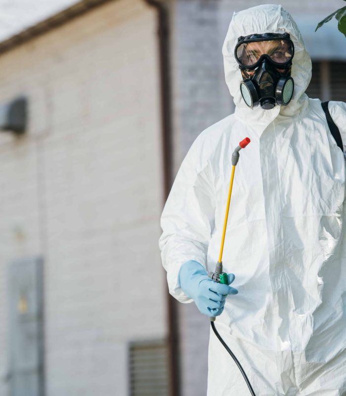 pest-control-worker-in-respirator-holding-sprayer-2024-11-18-06-07-04-utc-min