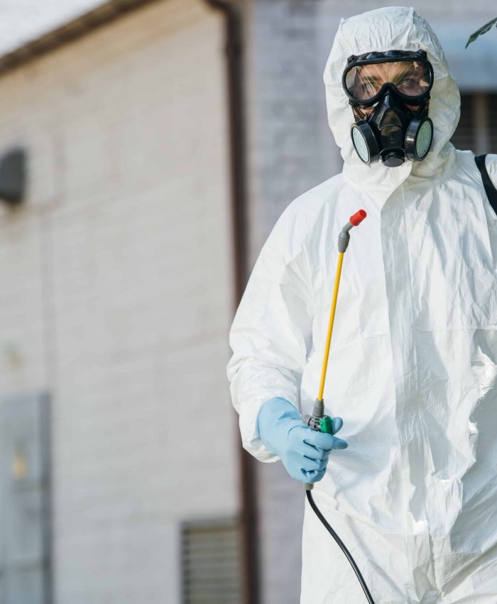 pest-control-worker-in-respirator-holding-sprayer-2024-11-18-06-07-04-utc-min